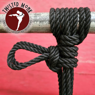 Langman black BDSM rope tied in a secure knot on a metal pole for bondage enthusiasts
