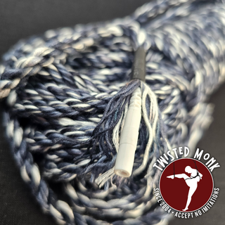 E-Stim bamboo rope by The Twisted Monk, featuring a colorful twisted design for unique sensations