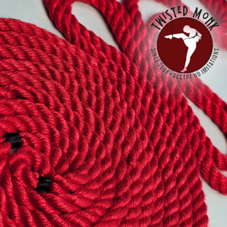 Close-up of hand-spun bamboo bondage rope in vibrant red, showcasing its quality and texture