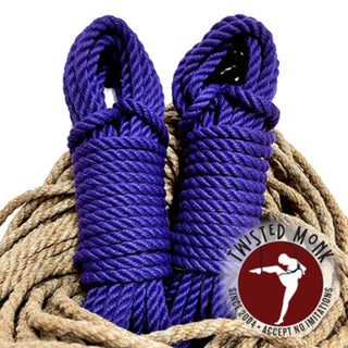 Two rolls of purple bondage rope twisted for secure use in various applications