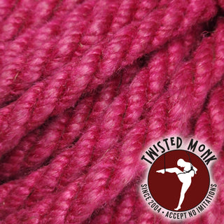 Close-up of raspberry hemp bondage rope by The Twisted Monk, featuring soft texture and vibrant color