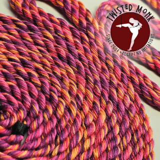 Sunset bamboo rope for bondage hand-spun, featuring vibrant pink and orange colors in a coiled design