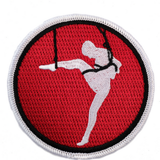 Twisted Monk patch featuring a silhouette of a person in a striking pose on a vibrant red background