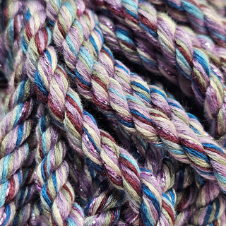 Close-up of bamboo bondage rope lilac with vibrant multi-colored strands for adult use
