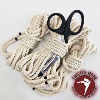 The Twisted Monk cotton bondage rope kit featuring multiple ropes and safety scissors for secure use