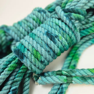 Hand-dyed cotton bondage rope in shades of blue and green, perfect for creative tying and decor