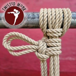 Natural spun polyester rope securely tied in a knot, ideal for various applications