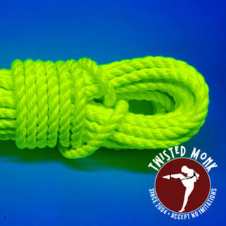 Bright UV yellow bondage rope coiled neatly, perfect for artistic and practical applications