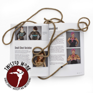 Shibari book set displayed open with photographs and instructions alongside decorative rope