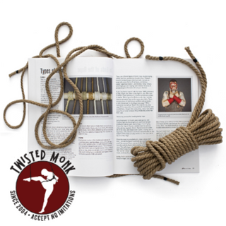 Open Japanese rope bondage book shibari by The Twisted Monk with detailed illustrations and rope